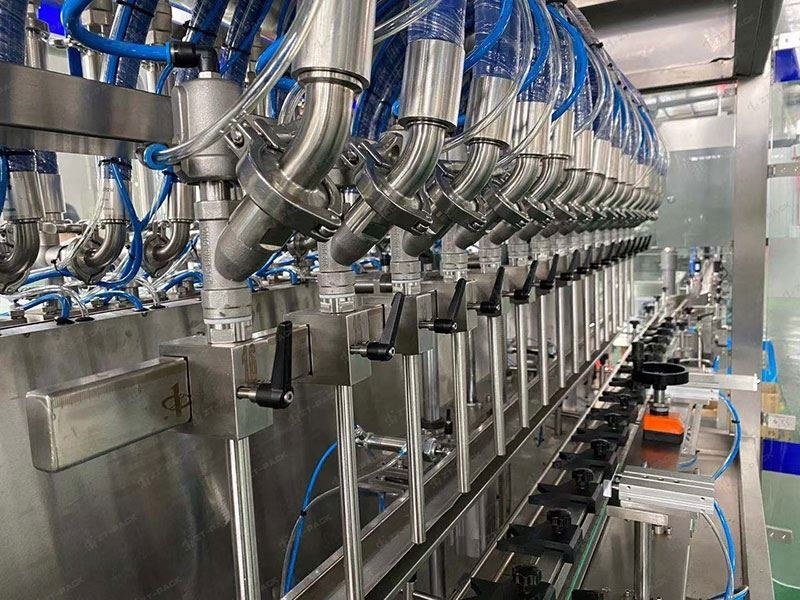 Stainless-steel filling line with nozzles
